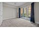 Comfortable bedroom with a private balcony, ideal for relaxation and enjoying the outside views at 4625 Piedmont Row Dr, Charlotte, NC 28210