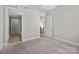 Welcoming bedroom with a view into the kitchen providing a harmonious flow throughout the home at 4625 Piedmont Row Dr, Charlotte, NC 28210