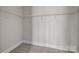 Walk-in closet featuring shelving and neutral carpeting for organized storage at 4625 Piedmont Row Dr, Charlotte, NC 28210