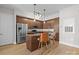Stylish kitchen boasts stainless steel appliances, granite countertops, and a cozy breakfast bar at 4625 Piedmont Row Dr, Charlotte, NC 28210