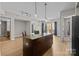 Open-concept kitchen featuring a large island, stainless steel appliances, and lots of natural light at 4625 Piedmont Row Dr, Charlotte, NC 28210
