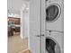 Laundry area featuring stacked washer and dryer at 4625 Piedmont Row Dr, Charlotte, NC 28210