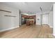 Spacious living room showcasing a modern kitchen with stainless steel appliances and hardwood floors at 4625 Piedmont Row Dr, Charlotte, NC 28210