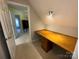 Attic space featuring a built-in desk and a doorway to another room at 5024 Ardenwoods Dr, Charlotte, NC 28215