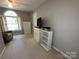 Bright bedroom with a large arched window and a comfortable chair at 5024 Ardenwoods Dr, Charlotte, NC 28215