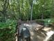 Outdoor deck surrounded by lush trees and foliage, creating a private escape at 5024 Ardenwoods Dr, Charlotte, NC 28215