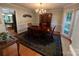 Formal dining room with a chandelier, hardwood floors, and a large window at 5024 Ardenwoods Dr, Charlotte, NC 28215