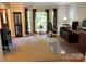 Bright home office with large windows, neutral carpet, and ample space for multiple desks and office equipment at 5024 Ardenwoods Dr, Charlotte, NC 28215