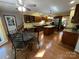 Open-concept kitchen and breakfast nook with granite counters and stainless steel appliances at 5024 Ardenwoods Dr, Charlotte, NC 28215