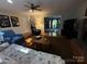 Spacious living room featuring a cozy fireplace, hardwood floors, and large windows at 5024 Ardenwoods Dr, Charlotte, NC 28215