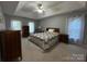 Serene bedroom with trey ceiling, neutral tones, and natural light at 5024 Ardenwoods Dr, Charlotte, NC 28215