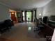 Comfortable office space featuring hardwood floors, neutral walls, and natural light at 5024 Ardenwoods Dr, Charlotte, NC 28215