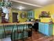 Open kitchen with breakfast bar, colorful decor, butcher block countertops, and wood flooring at 508 E Rice St, Landis, NC 28088