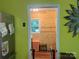 Bright laundry room with wood paneling and view of the yard at 508 E Rice St, Landis, NC 28088