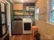 Laundry room with washer, dryer, folding area and upper shelving at 508 E Rice St, Landis, NC 28088