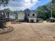 Expansive backyard features an outdoor seating area, a grill, and partial fencing at 508 E Rice St, Landis, NC 28088