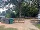 Fully fenced backyard with lots of room for outdoor living, with bins and gates at 508 E Rice St, Landis, NC 28088