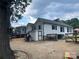 Exterior backyard of home with mature trees, fencing, and ample space for outdoor activities at 508 E Rice St, Landis, NC 28088