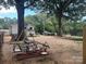 Extensive backyard with mature trees, playground, trampoline, and a classic merry-go-round at 508 E Rice St, Landis, NC 28088