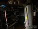 Basement utilities with water heater, air compressor, and shelving for storage solutions at 508 E Rice St, Landis, NC 28088
