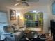 Comfortable living room with hardwood floors, neutral color walls, a ceiling fan, and an archway to the eat-in kitchen at 508 E Rice St, Landis, NC 28088