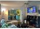 Cozy living room with an open doorway to the kitchen, ceiling fan, and entertainment center with a television at 508 E Rice St, Landis, NC 28088