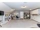 Large bonus room with built-in cabinets, peg boards, and carpet flooring at 5129 Devonshire Rd, Denver, NC 28037