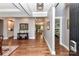 Elegant entryway boasting hardwood floors, tray ceilings, and an open view into the living spaces at 5129 Devonshire Rd, Denver, NC 28037