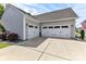 Exterior of the two-car garage featuring an extra wide driveway at 5129 Devonshire Rd, Denver, NC 28037