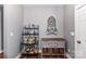 Nicely decorated hallway with shelving, cabinet and decorative window adding character and storage space at 5129 Devonshire Rd, Denver, NC 28037