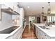 Beautiful kitchen with white cabinets, stainless steel appliances, and hardwood floors at 5129 Devonshire Rd, Denver, NC 28037