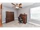 A home office space with carpet, wooden furniture, and a ceiling fan at 5129 Devonshire Rd, Denver, NC 28037