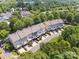 Aerial view of houses with decks surrounded by trees and green landscapes at 570 Sixth Baxter Xing # 16, Fort Mill, SC 29708
