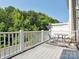 Back deck with furniture and a fence with view of trees and street at 570 Sixth Baxter Xing # 16, Fort Mill, SC 29708