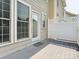 Wooden back deck with back door, privacy fence, and many windows at 570 Sixth Baxter Xing # 16, Fort Mill, SC 29708