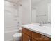 Bathroom with white tub and shower combination, modern faucet, and white vanity countertop at 570 Sixth Baxter Xing # 16, Fort Mill, SC 29708