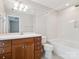 Bathroom featuring wood vanity, toilet and shower/tub combo at 570 Sixth Baxter Xing # 16, Fort Mill, SC 29708