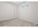 Neutral bedroom with carpet, window, and electrical outlets at 570 Sixth Baxter Xing # 16, Fort Mill, SC 29708