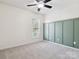 Bright bedroom featuring green accent wall and plush carpet at 570 Sixth Baxter Xing # 16, Fort Mill, SC 29708