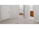 Carpeted bedroom with view of stairs and adjacent bathroom entrance at 570 Sixth Baxter Xing # 16, Fort Mill, SC 29708
