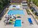 A vibrant aerial view of the community pool including water slides, seating and play area at 570 Sixth Baxter Xing # 16, Fort Mill, SC 29708