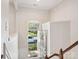 Bright foyer with stairs, a coat closet, and an arched window above the front door at 570 Sixth Baxter Xing # 16, Fort Mill, SC 29708