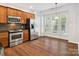 Bright kitchen with stainless steel appliances, ample cabinet space, and an eat-in area at 570 Sixth Baxter Xing # 16, Fort Mill, SC 29708