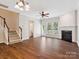 Inviting living room with hardwood floors, fireplace, and stairs, perfect for entertaining at 570 Sixth Baxter Xing # 16, Fort Mill, SC 29708