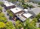 An aerial shot shows outdoor rooftop dining with tables, umbrellas, and views of the neighborhood at 570 Sixth Baxter Xing # 16, Fort Mill, SC 29708