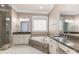 Bathroom with separate sinks, shower and bath, and decorative tile work at 6612 Saunton Ct, Charlotte, NC 28277