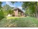 A spacious lawn complements the exterior of this stately brick home at 6612 Saunton Ct, Charlotte, NC 28277