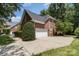 Side view of a beautiful brick home with a two-car garage and a well-maintained lawn at 6612 Saunton Ct, Charlotte, NC 28277