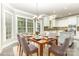 Inviting eat-in kitchen area filled with natural light from a bay window at 6612 Saunton Ct, Charlotte, NC 28277