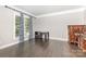 Well-lit office space with dark hardwood flooring and decorative trim at 6612 Saunton Ct, Charlotte, NC 28277